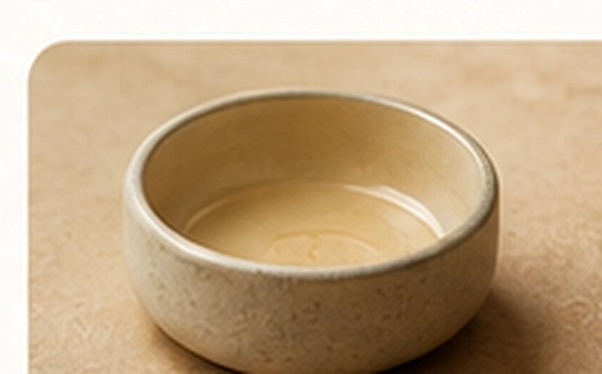 Warm yellow ceramic bowl in soft natural light